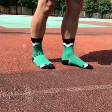 Green football patterned athletic crew socks for men-1